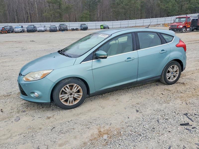 FORD FOCUS 2012 with VIN 1FAHP3M22CL303074 - Photo from auction