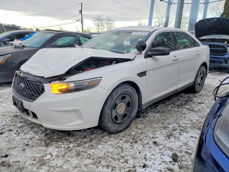 FORD TAURUS POL 2015 with VIN 1FAHP2MK9FG145985 - Photo from auction