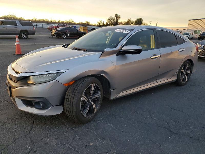 HONDA CIVIC TOUR 2017 with VIN 19XFC1F91HE204693 - Photo from auction