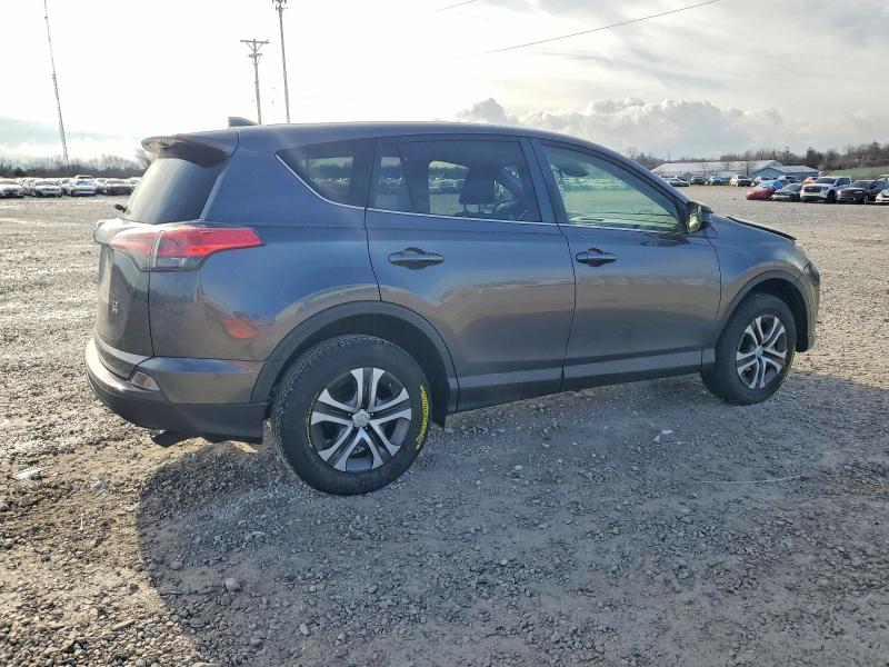 Photo 3 from auction – 2018 TOYOTA RAV4 LE with VIN JTMBFREV3JJ732571