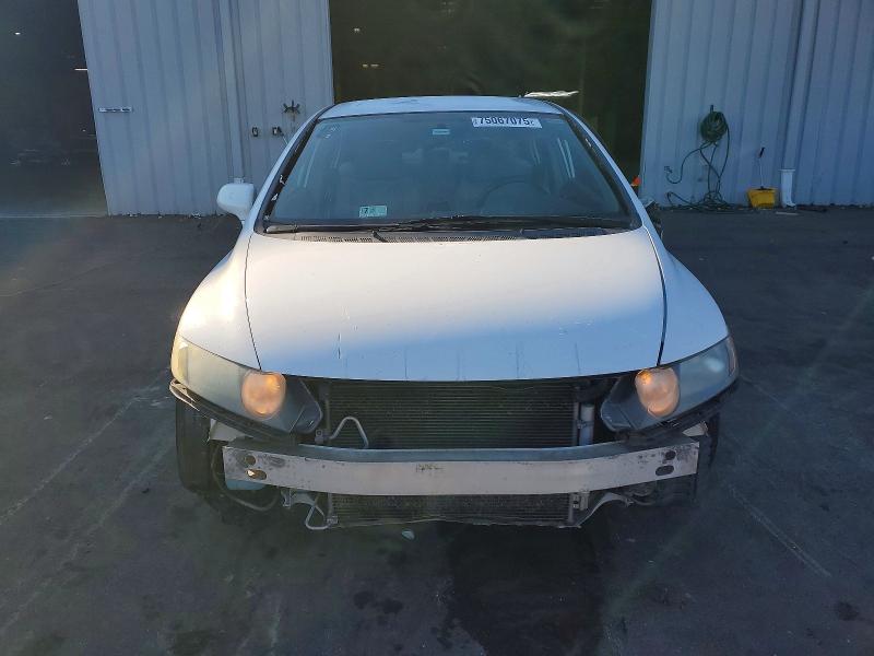 Photo 5 from auction – 2011 HONDA CIVIC LX with VIN 19XFA1F53BE031933