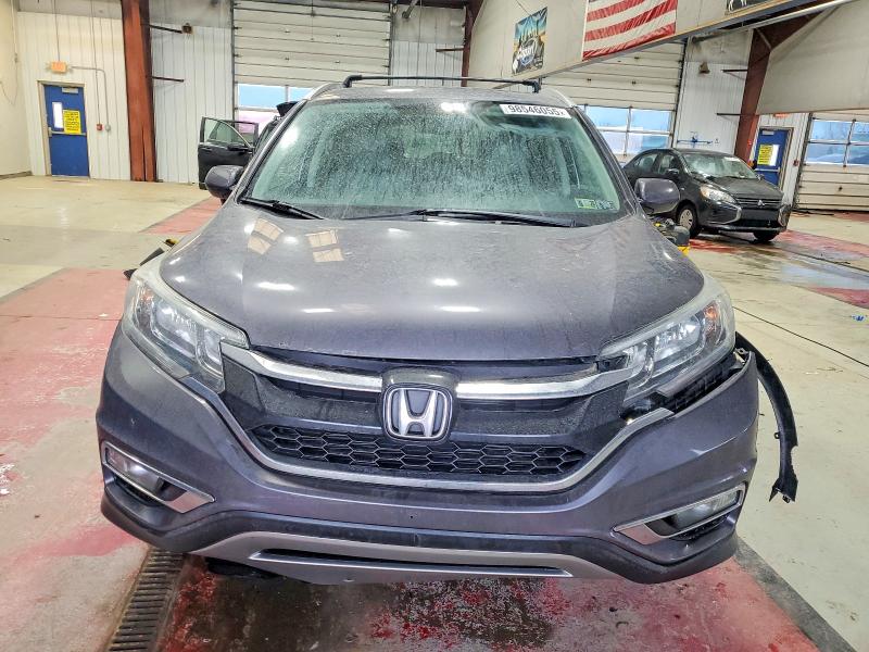 Photo 5 from auction – 2016 HONDA CR-V EXL with VIN 5J6RM4H70GL033457