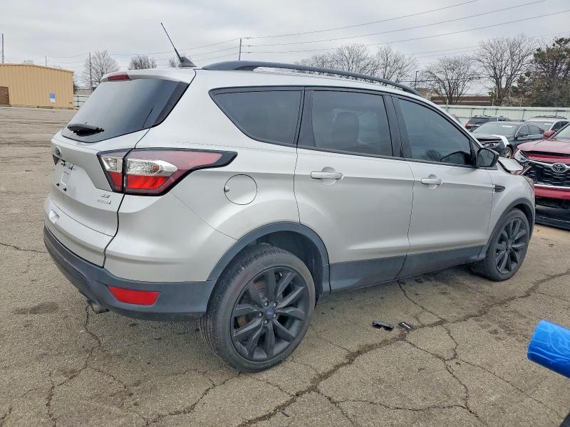Photo 3 from auction – 2018 FORD ESCAPE SE with VIN 1FMCU0GD6JUB35158