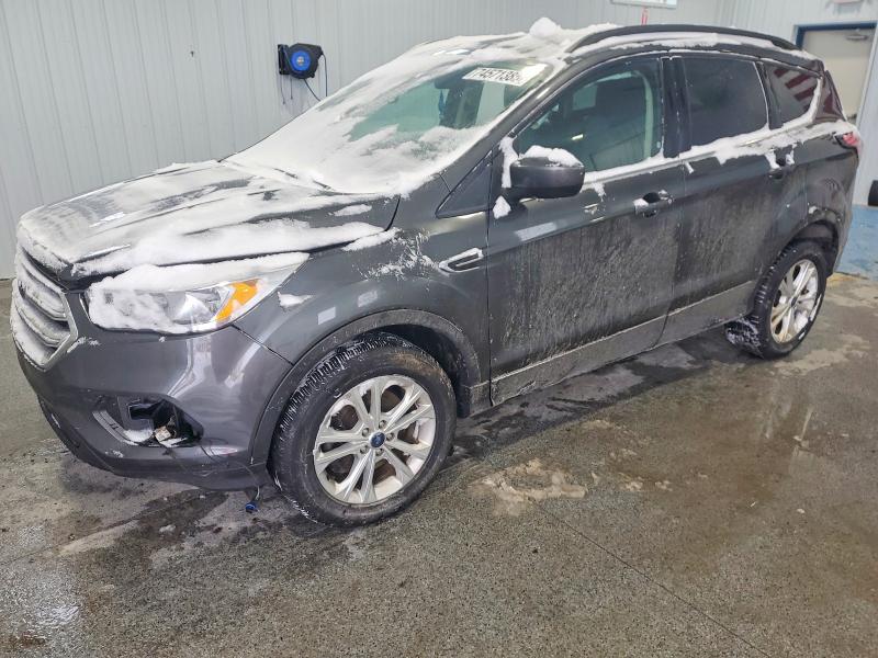 FORD ESCAPE 2018 with VIN 1FMCU9GD0JUB80021 - Photo from auction