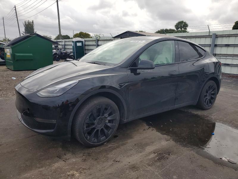 TESLA MODEL Y 2024 with VIN 7SAYGDED0RF103065 - Photo from auction