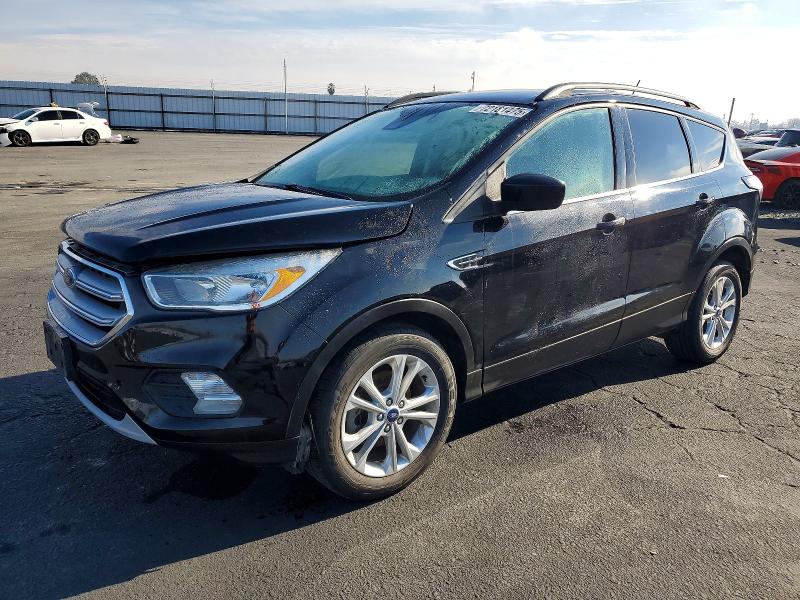 FORD ESCAPE SE 2018 with VIN 1FMCU0GD9JUB17107 - Photo from auction