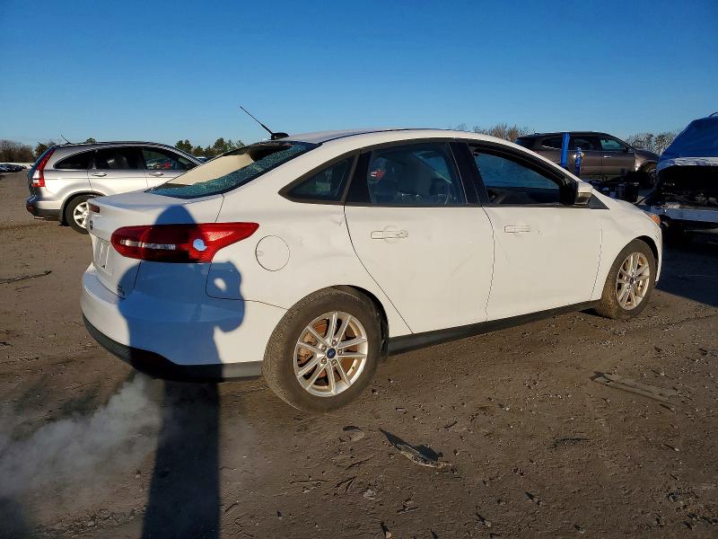 Photo 3 from auction – 2016 FORD FOCUS SE with VIN 1FADP3FE0GL237040