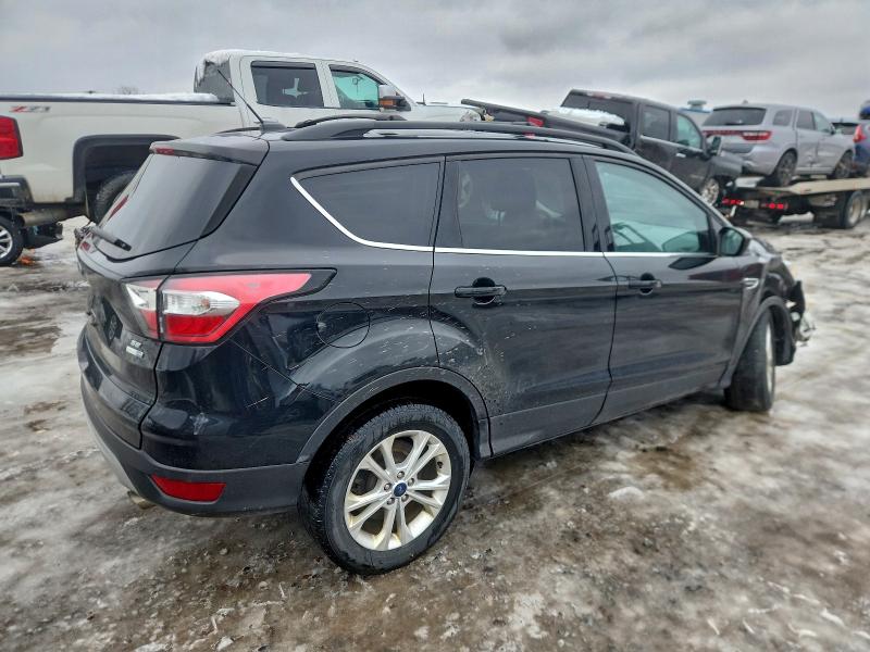 Photo 3 from auction – 2017 FORD ESCAPE SE with VIN 1FMCU9G9XHUD33008