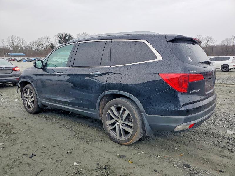 Photo 2 from auction – 2016 HONDA PILOT TOUR with VIN 5FNYF5H91GB047731