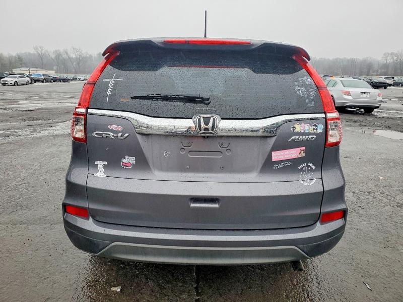 Photo 6 from auction – 2016 HONDA CR-V LX with VIN 5J6RM4H33GL117690