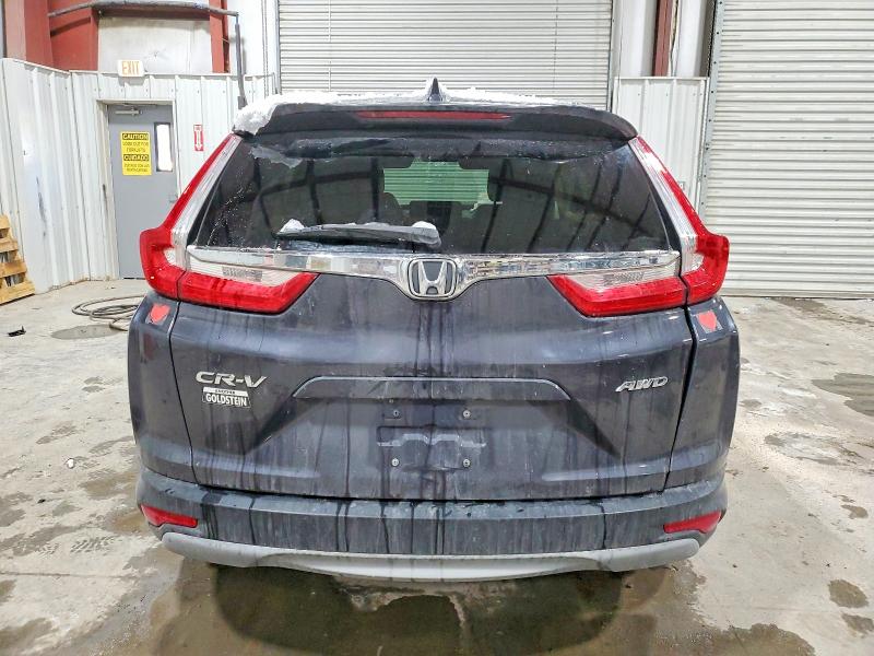 Photo 6 from auction – 2018 HONDA CR-V with VIN 7FARW2H59JE021258