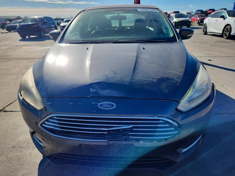 Photo 5 from auction – 2015 FORD FOCUS TITA with VIN 1FADP3J24FL384599