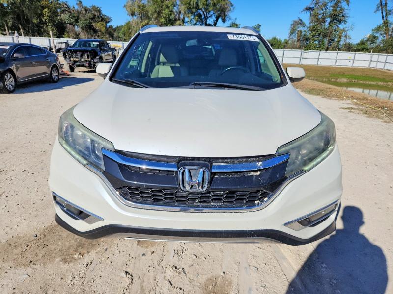 Photo 5 from auction – 2015 HONDA CR-V with VIN 5J6RM3H75FL023886