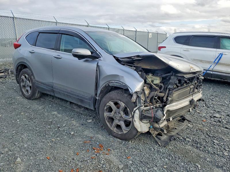 Photo 4 from auction – 2018 HONDA CR-V with VIN 2HKRW2H53JH115276