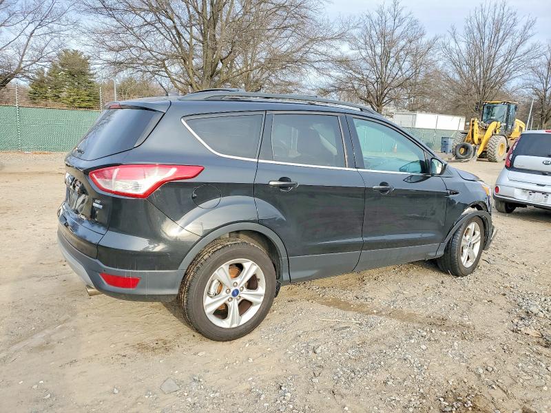 Photo 3 from auction – 2014 FORD ESCAPE with VIN 1FMCU9GX6EUD35414