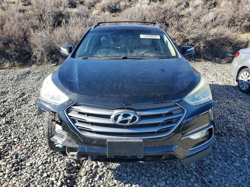 Photo 5 from auction – 2017 HYUNDAI SANTA FE S with VIN 5NMZU3LB7HH018792