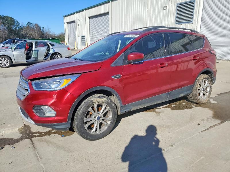 FORD ESCAPE SE 2018 with VIN 1FMCU0GD5JUD34007 - Photo from auction