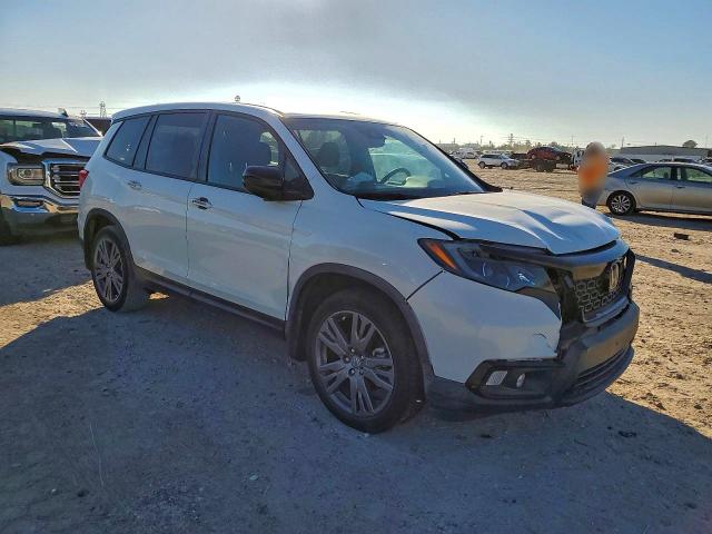 Photo 4 from auction – 2021 HONDA PASSPORT E with VIN 5FNYF7H5XMB015591