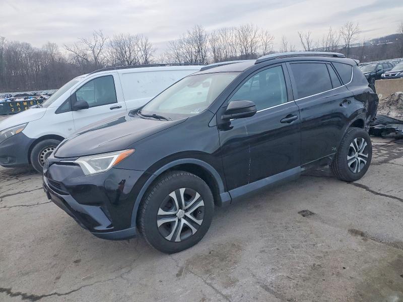TOYOTA RAV4 LE 2018 with VIN 2T3BFREV2JW698883 - Photo from auction