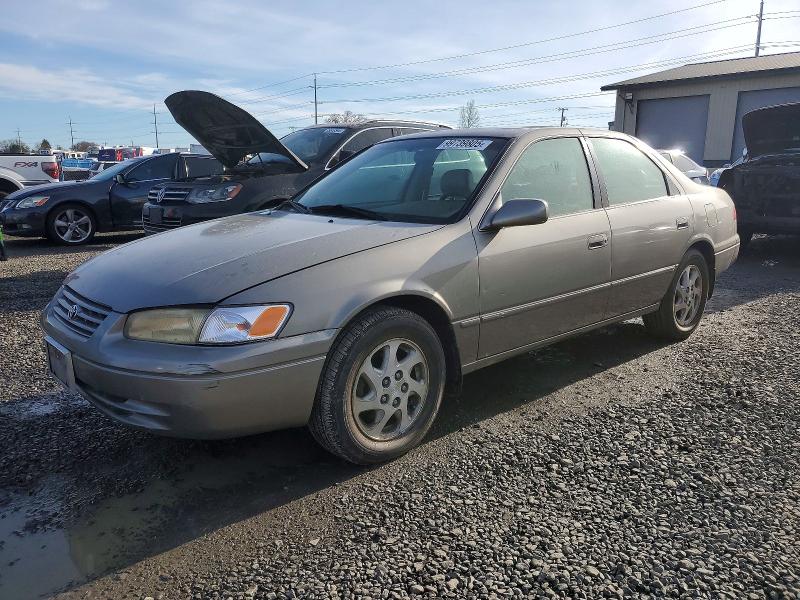 TOYOTA CAMRY LE 1998 with VIN JT2BF28K8W0115097 - Photo from auction