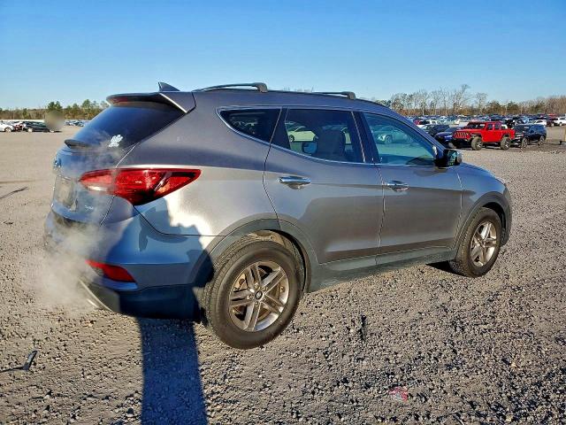 Photo 3 from auction – 2018 HYUNDAI SANTA FE S with VIN 5NMZU3LB0JH079651