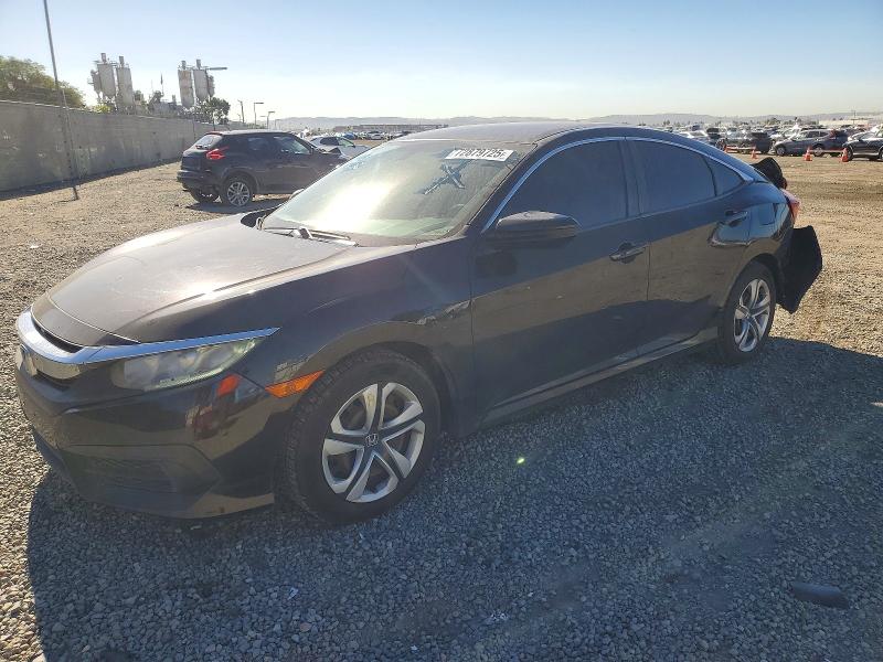 HONDA CIVIC LX 2018 with VIN 19XFC2F58JE207664 - Photo from auction