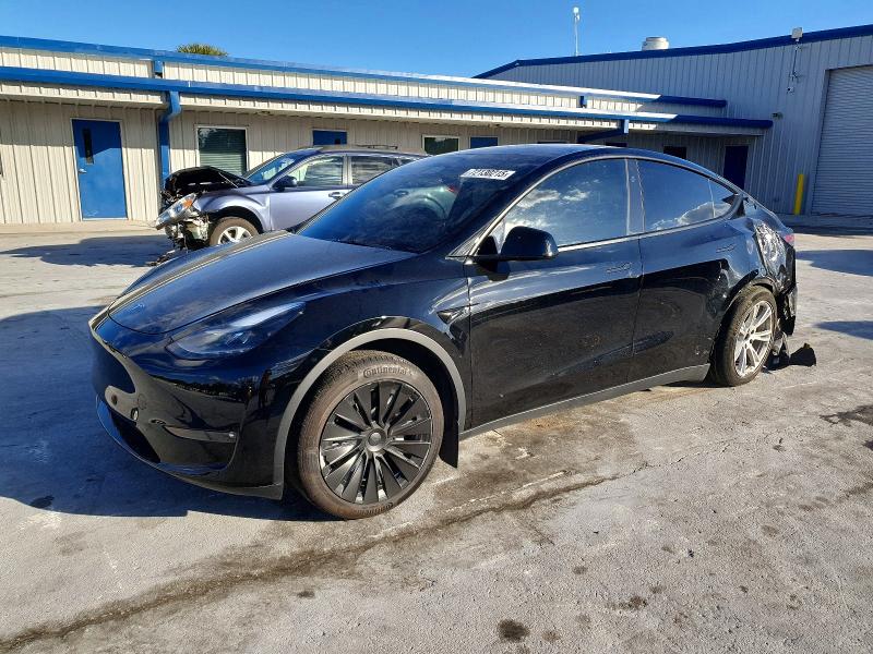TESLA MODEL Y 2023 with VIN 7SAYGAEE0PF942010 - Photo from auction