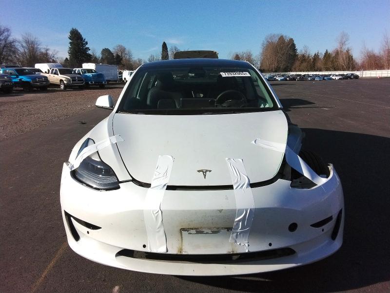 Photo 5 from auction – 2021 TESLA MODEL 3 with VIN 5YJ3E1EA6MF098464