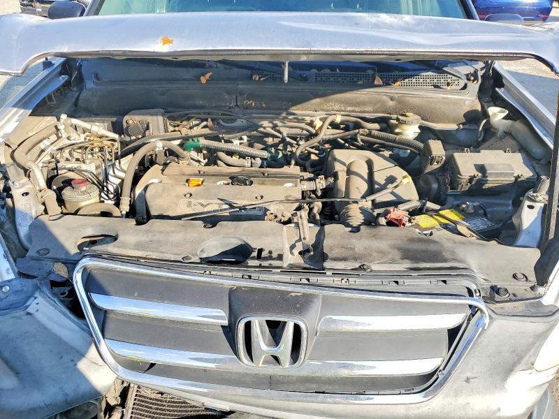 Photo 12 from auction – 2006 HONDA CR-V LX with VIN JHLRD68566C008404