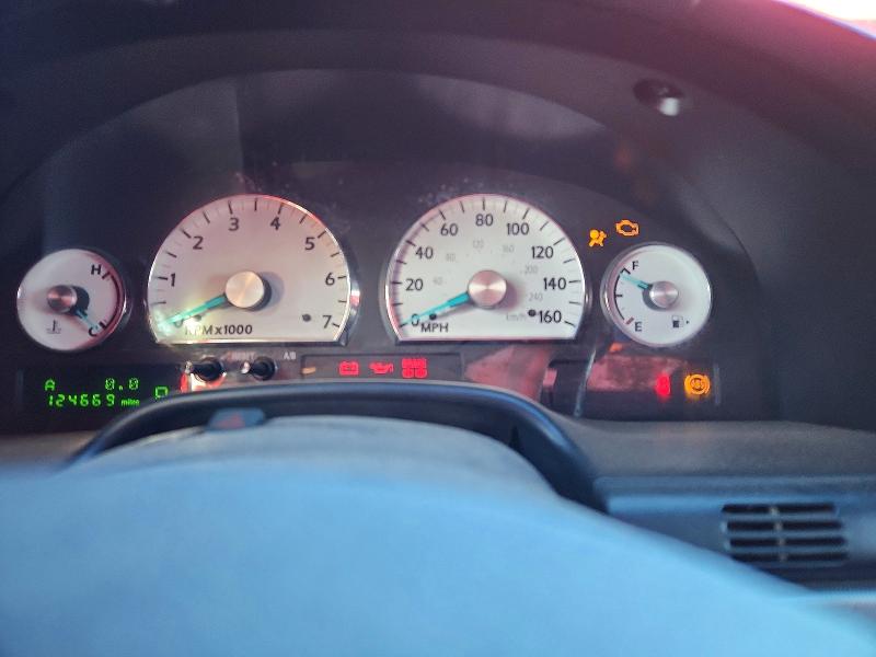 Photo 9 from auction – 2005 FORD THUNDERBIR with VIN 1FAHP60A05Y100060
