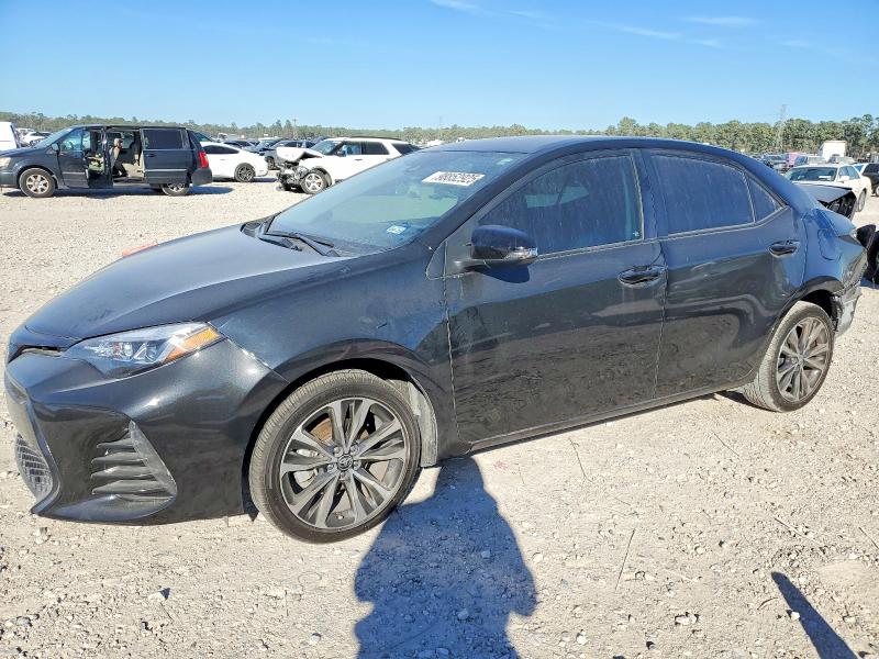 TOYOTA COROLLA L 2017 with VIN 5YFBURHEXHP633124 - Photo from auction