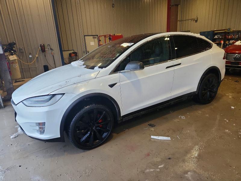 TESLA MODEL X 2020 with VIN 5YJXCBE4XLF262031 - Photo from auction