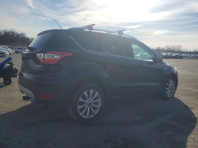 Photo 3 from auction – 2017 FORD ESCAPE TIT with VIN 1FMCU9J99HUD33638