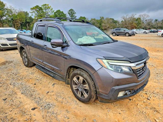 Photo 4 from auction – 2017 HONDA RIDGELINE with VIN 5FPYK2F62HB009274