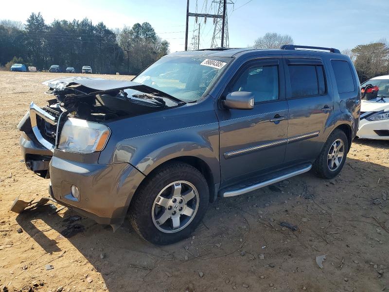 HONDA PILOT TOUR 2011 with VIN 5FNYF4H97BB101844 - Photo from auction