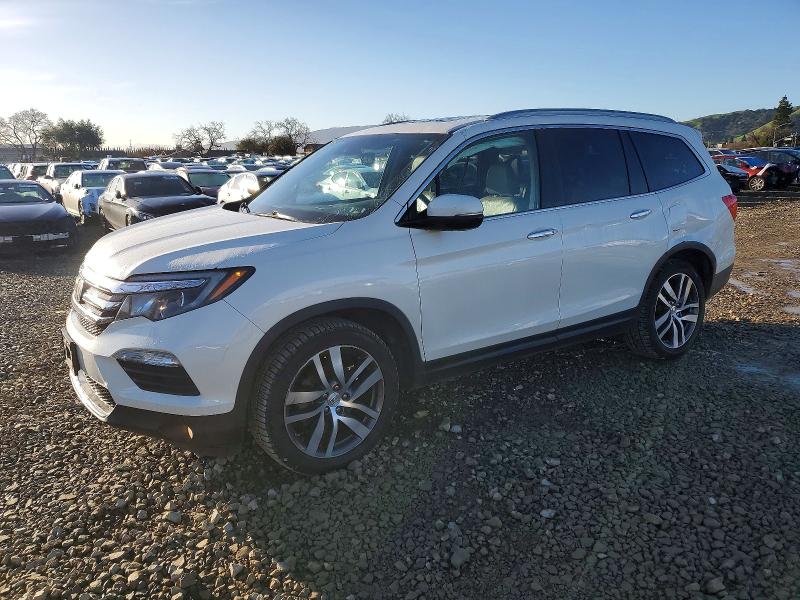 HONDA PILOT TOUR 2016 with VIN 5FNYF6H91GB076930 - Photo from auction