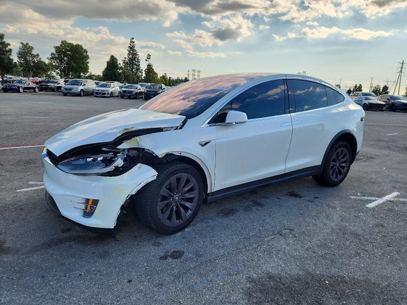 TESLA MODEL X 2018 with VIN 5YJXCAE24JF090181 - Photo from auction