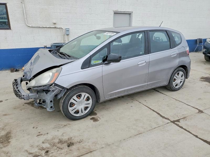 HONDA FIT 2010 with VIN JHMGE8G23AC010865 - Photo from auction