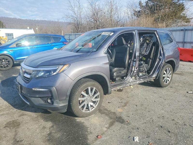 HONDA PILOT EXL 2021 with VIN 5FNYF6H50MB033561 - Photo from auction