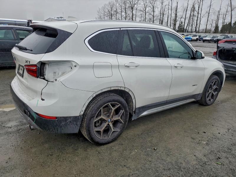 Photo 3 from auction – 2017 BMW X1 XDRIVE2 with VIN WBXHT3C30H5F69386