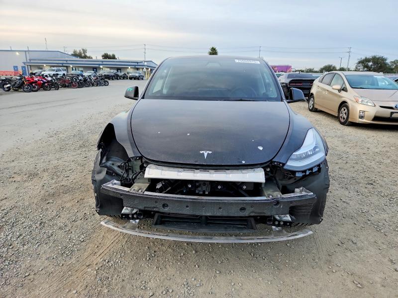Photo 12 from auction – 2021 TESLA MODEL Y with VIN 5YJYGAEE0MF272659