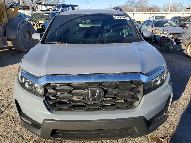 Photo 5 from auction – 2022 HONDA PASSPORT with VIN 5FNYF7H55NB003785