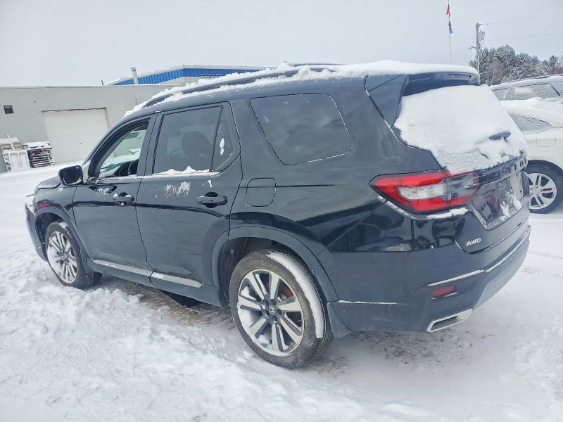 Photo 2 from auction – 2023 HONDA PILOT TOUR with VIN 5FNYG1H75PB503931