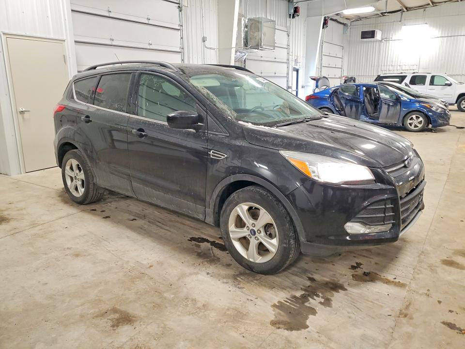 Photo 4 from auction – 2015 FORD ESCAPE SE with VIN 1FMCU9G98FUB62577