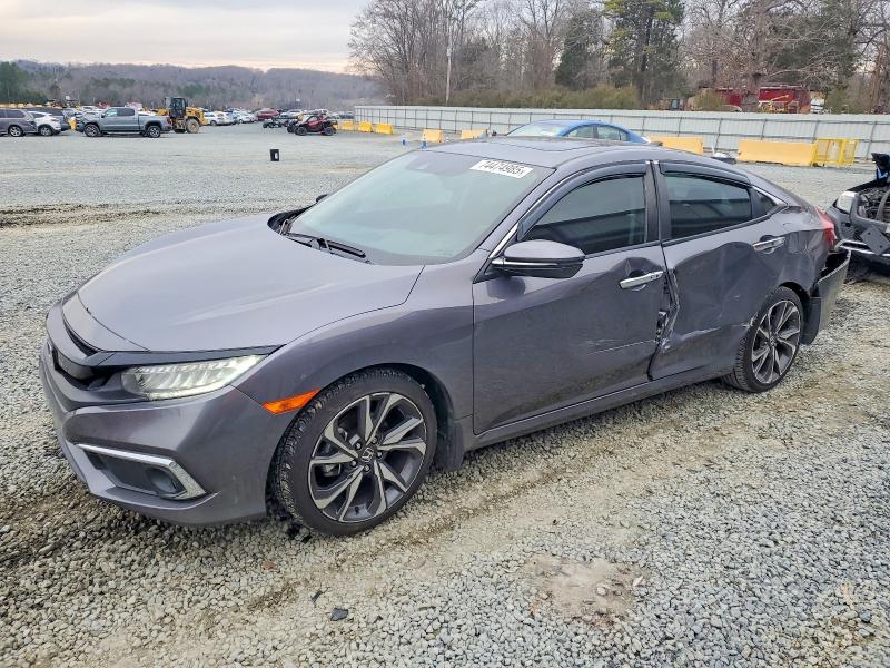 HONDA CIVIC 2020 with VIN 19XFC1F90LE008799 - Photo from auction