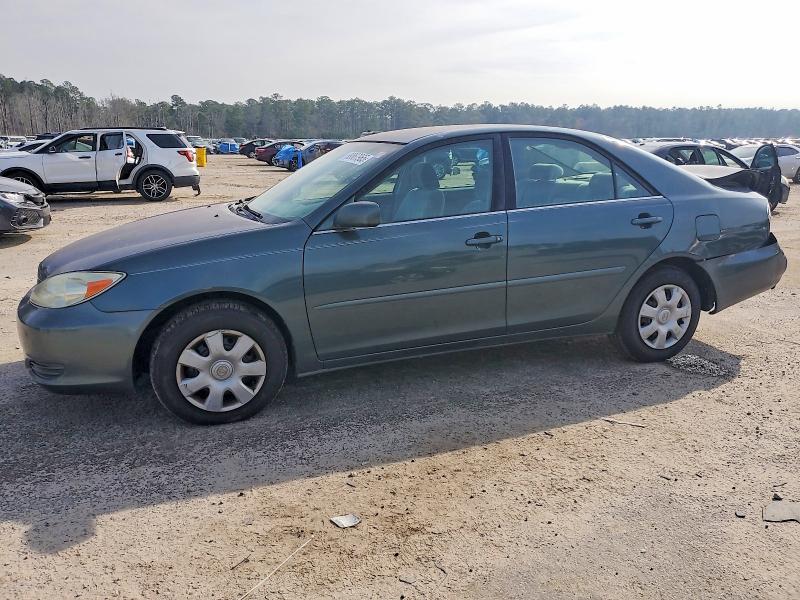 TOYOTA CAMRY LE 2003 with VIN 4T1BE30KX3U718886 - Photo from auction