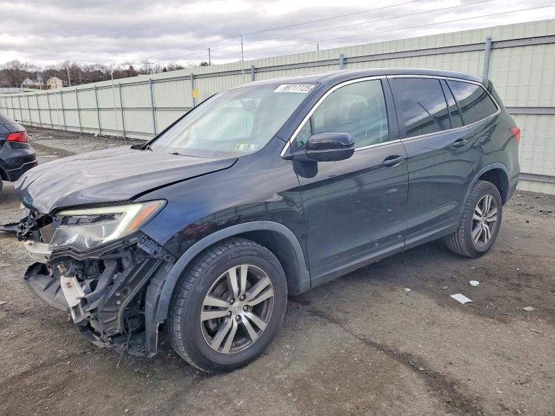 HONDA PILOT EXL 2016 with VIN 5FNYF6H52GB067604 - Photo from auction