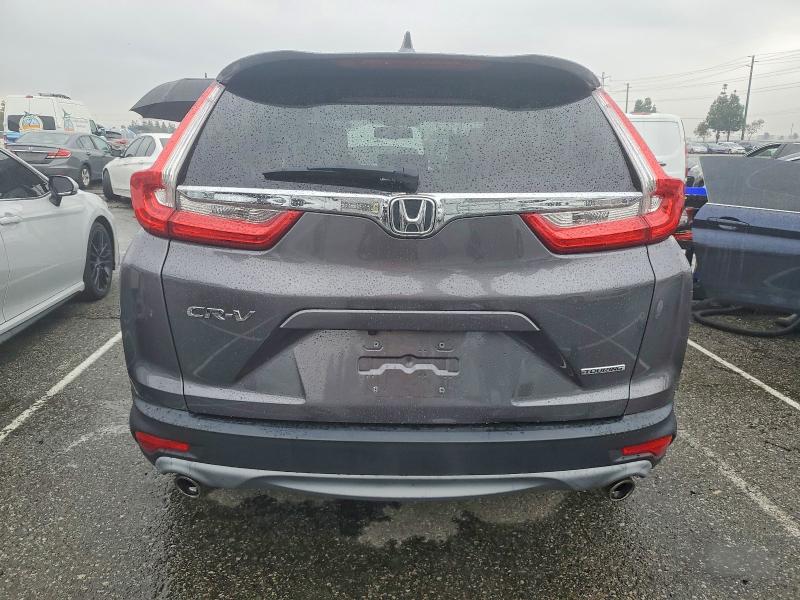 Photo 6 from auction – 2017 HONDA CR-V with VIN 2HKRW1H91HH516283