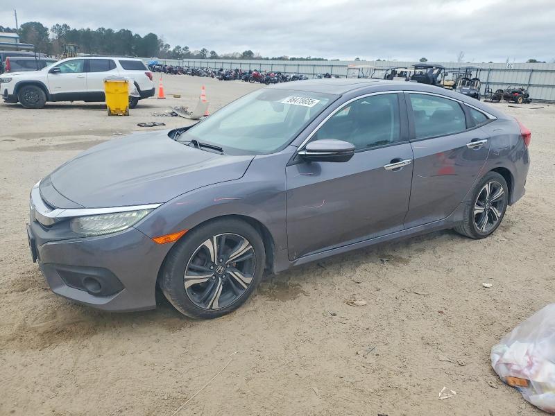 HONDA CIVIC TOUR 2016 with VIN 2HGFC1F9XGH636588 - Photo from auction