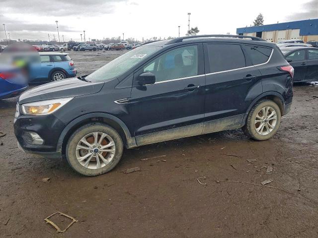 FORD ESCAPE SE 2018 with VIN 1FMCU9GD0JUC37348 - Photo from auction
